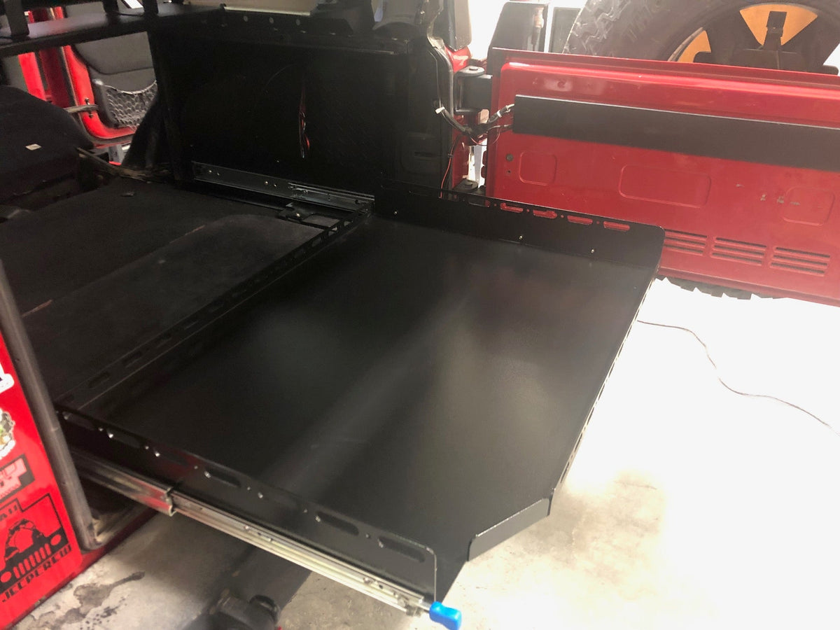 Angled view of the extended JKU slide floor showing the steel slides