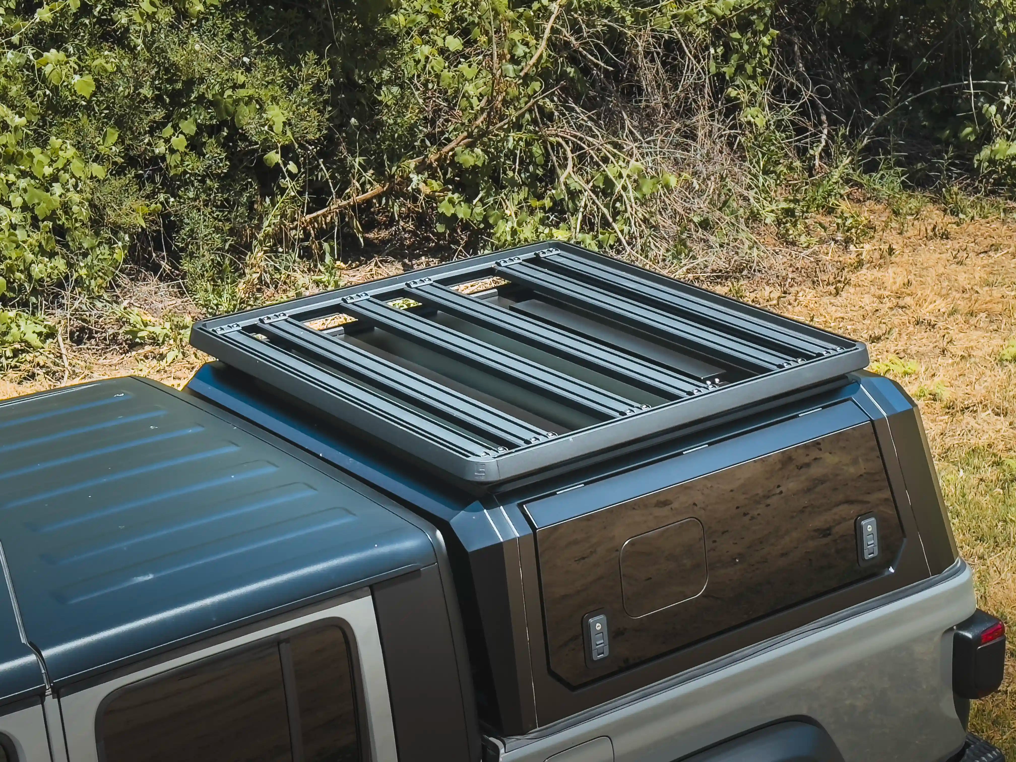 Truck with ACS Roof Platform on SmartCap navigating rugged terrain, emphasizing durability and off-road readiness.