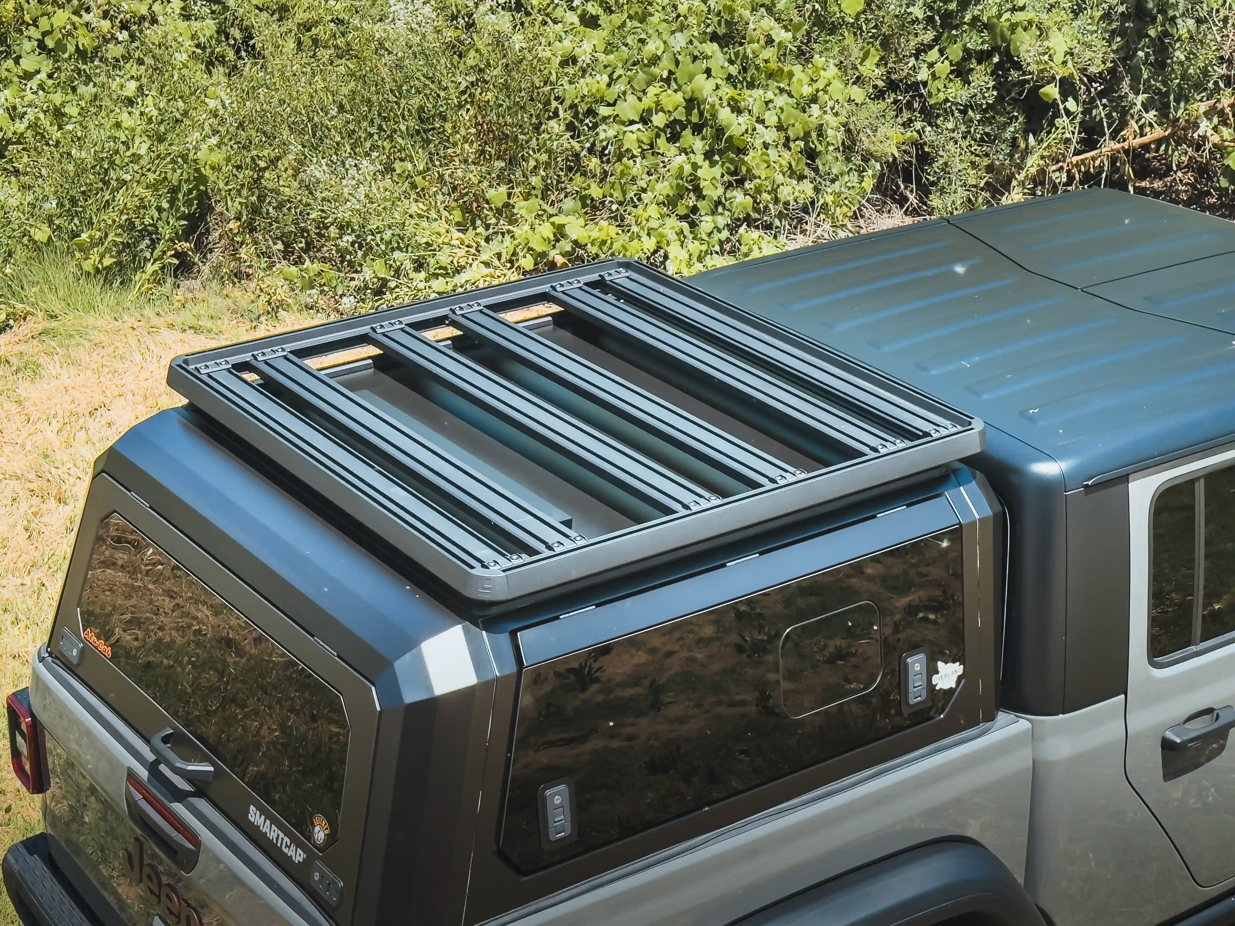 Truck with ACS Roof Platform on SmartCap navigating rugged terrain, emphasizing durability and off-road readiness.
