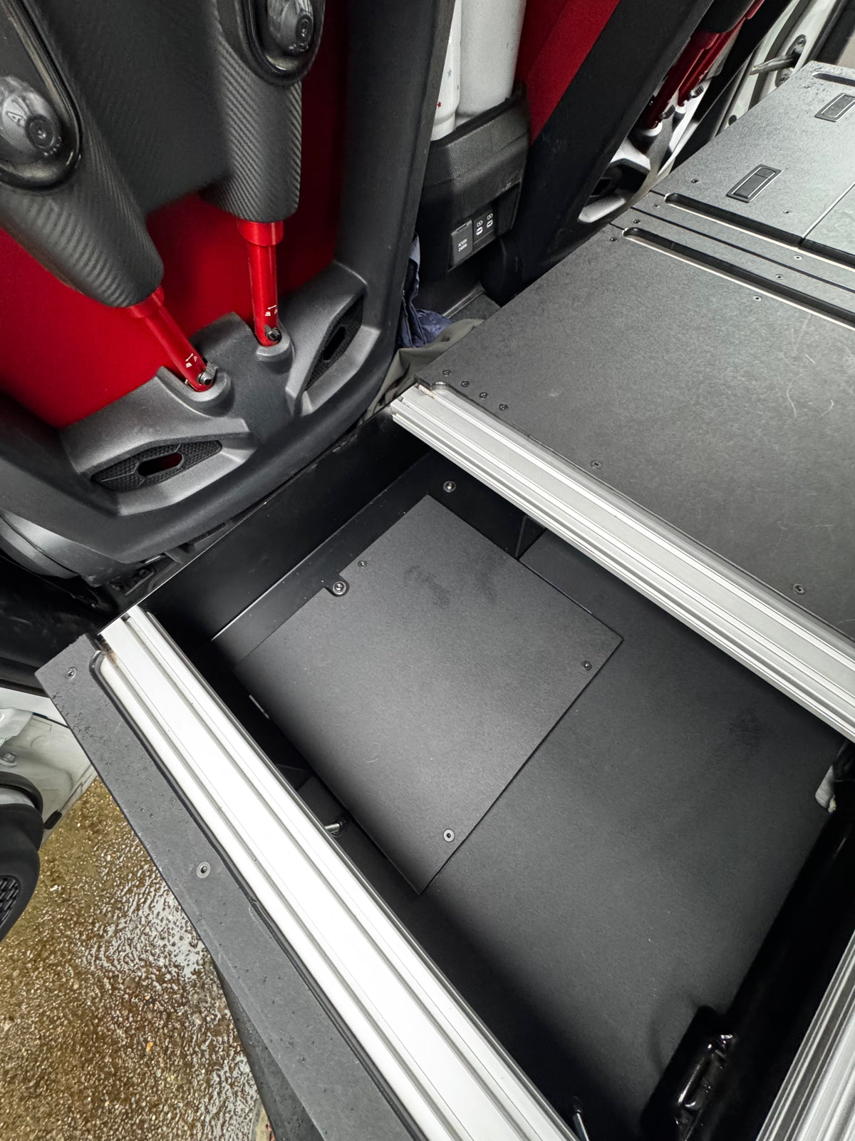 CargoKits Rear Seat Delete in a Tacoma TRD Pro Hybrid, close-up of the CargoKits identification plate