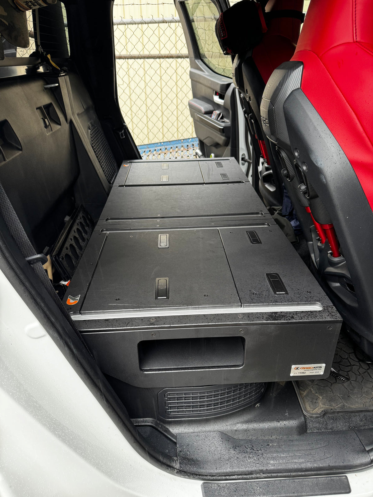 CargoKits Rear Seat Delete in a Tacoma TRD Pro Hybrid, real install photo from a rear angle