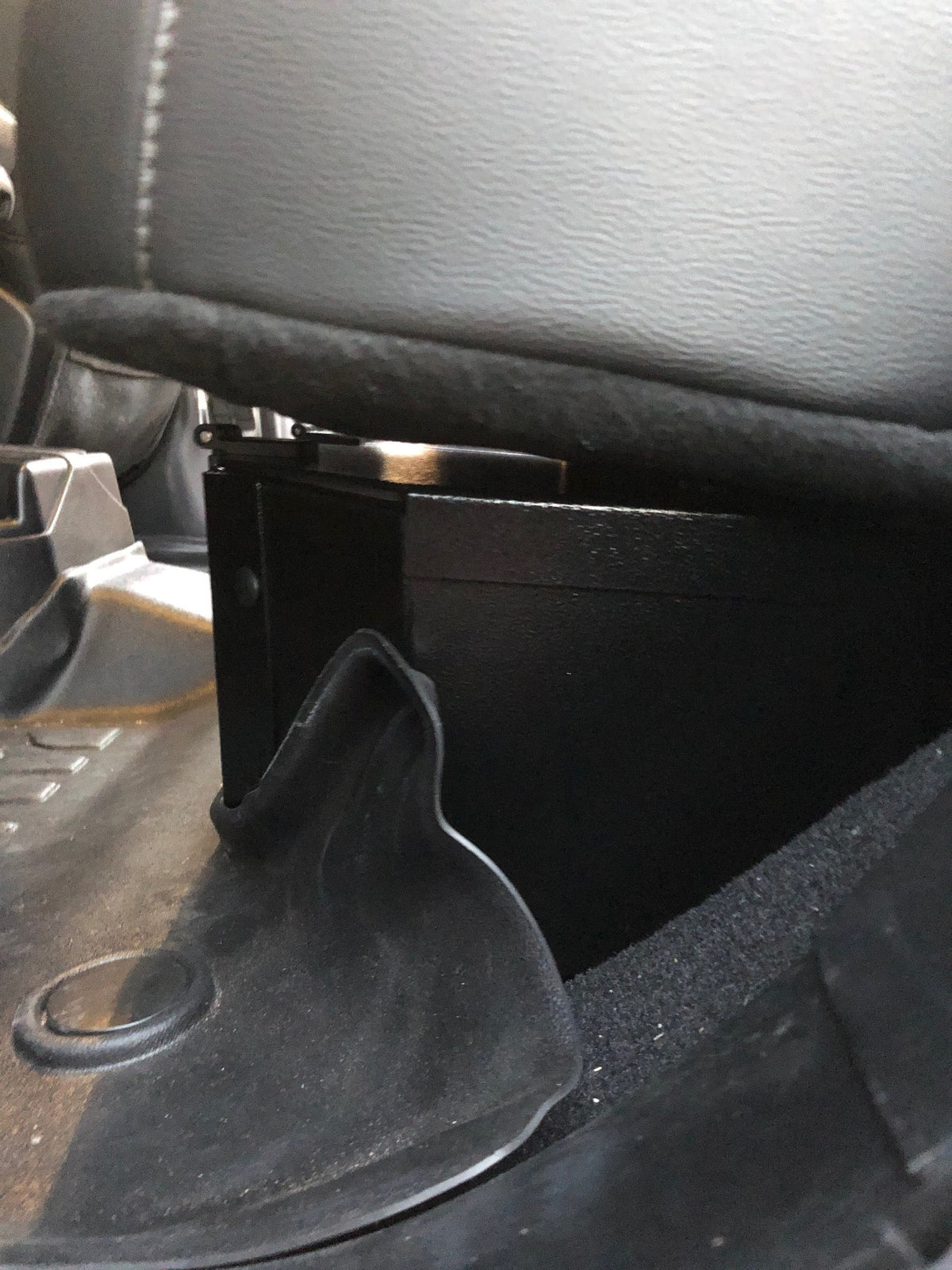 End of the lock box tucked under the Gladiator seat cushion