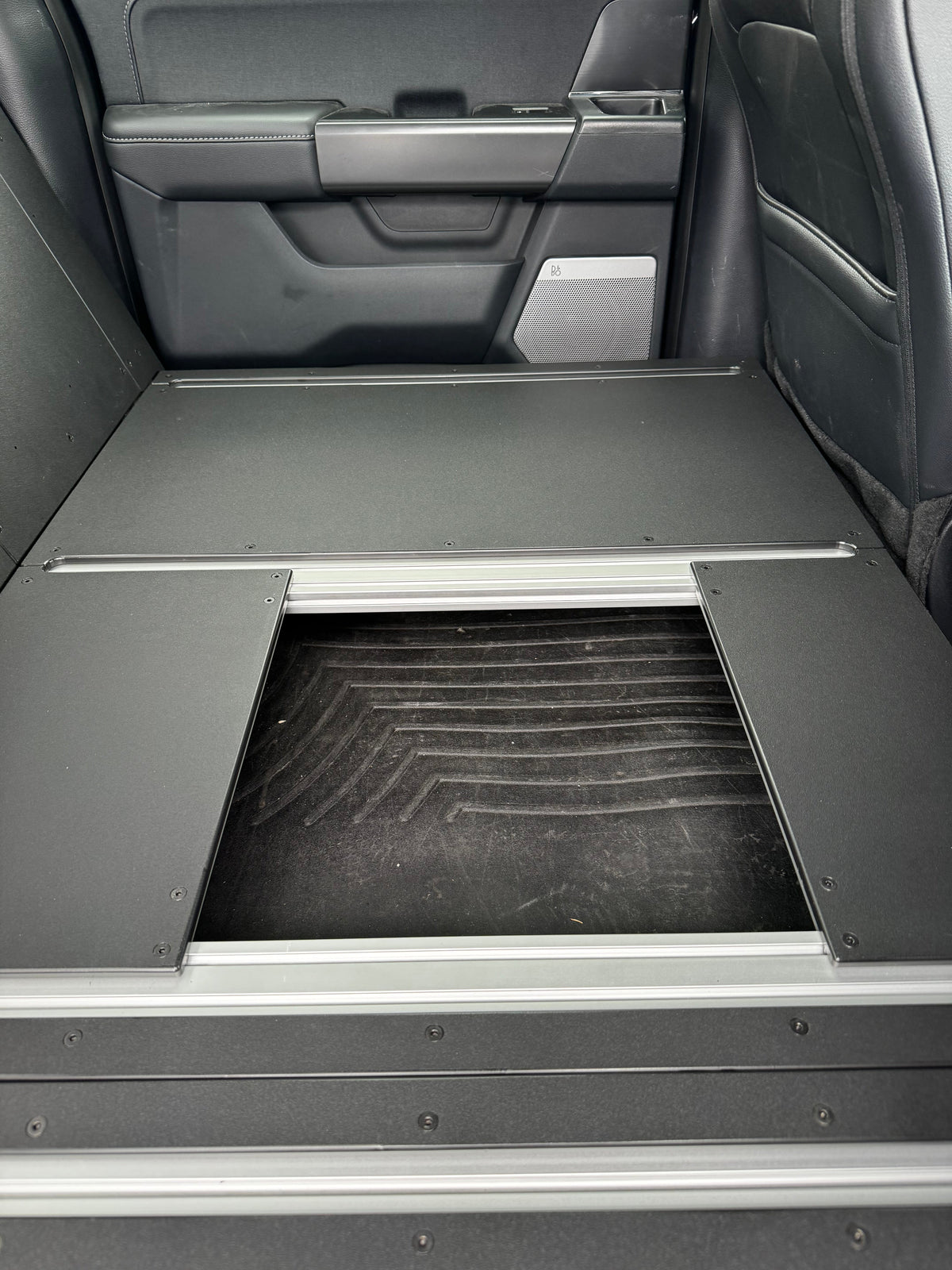 CargoKits Rear Seat Delete in a Ford F-Series SuperCrew, view of the lower storage cubby beneath the platform floor