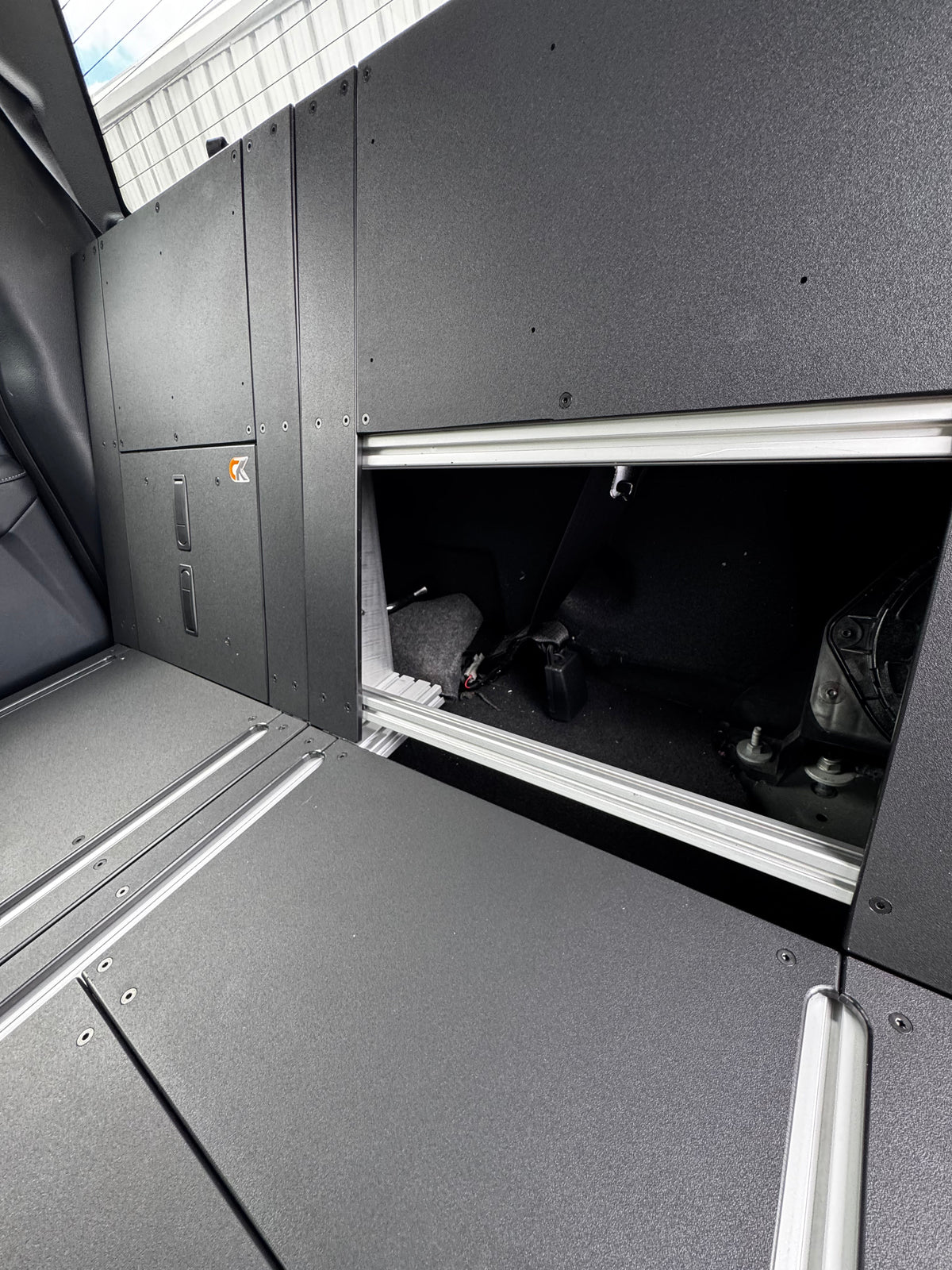 CargoKits Rear Seat Delete in a Ford F-Series SuperCrew, close-up of the accessory rail hardware