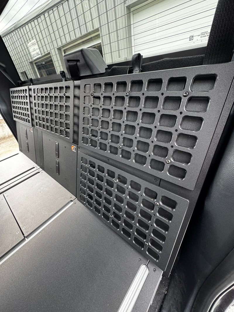 CargoKits Universal Molle Panel mounted on the side wall above a Rear Seat Delete platform, shown installed in a Ford F-Series SuperCrew
