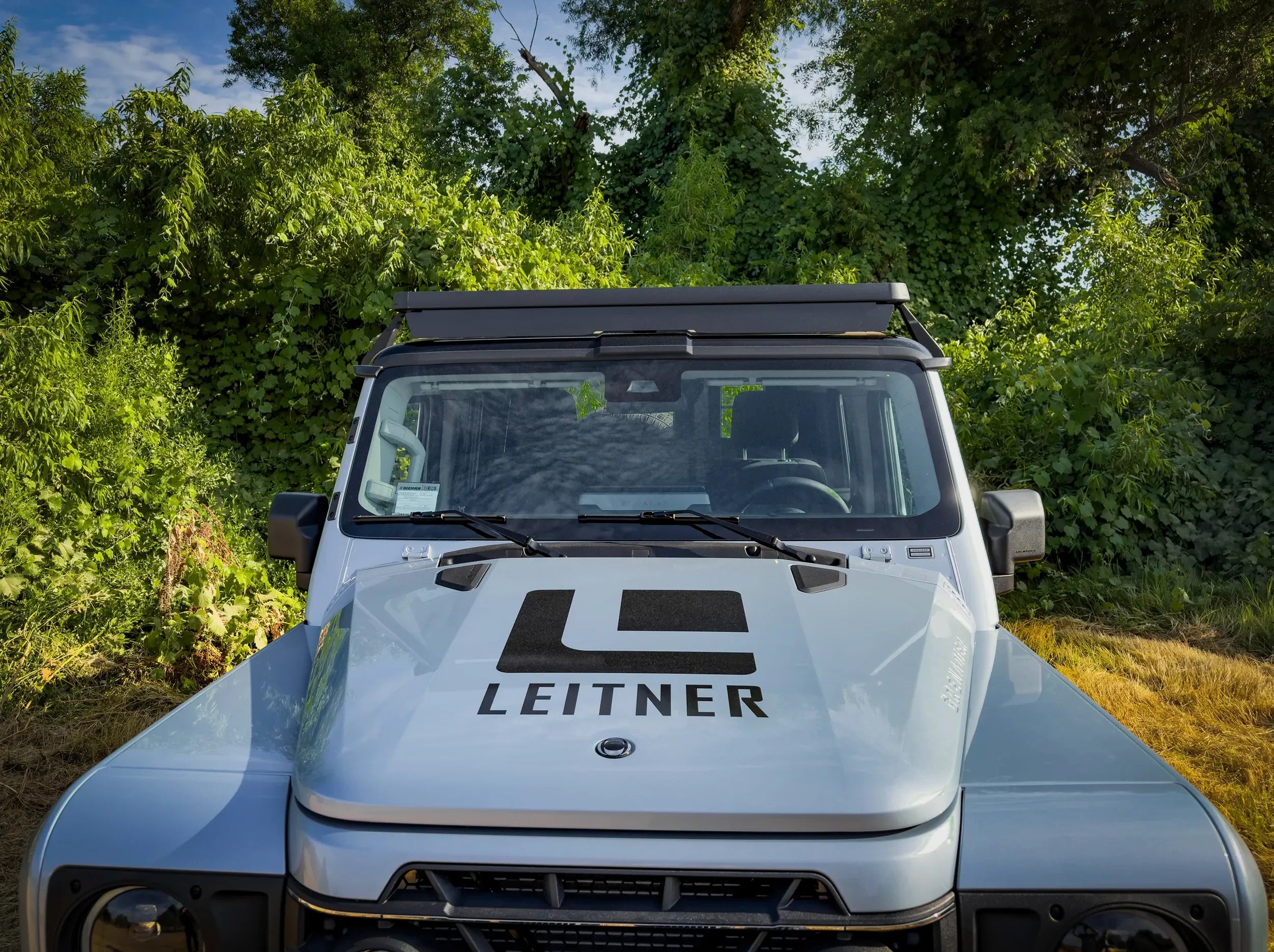 FRONT VIEW OF INEOS GRENADIER FULL LENGTH ROOF RACK MOUNTED 