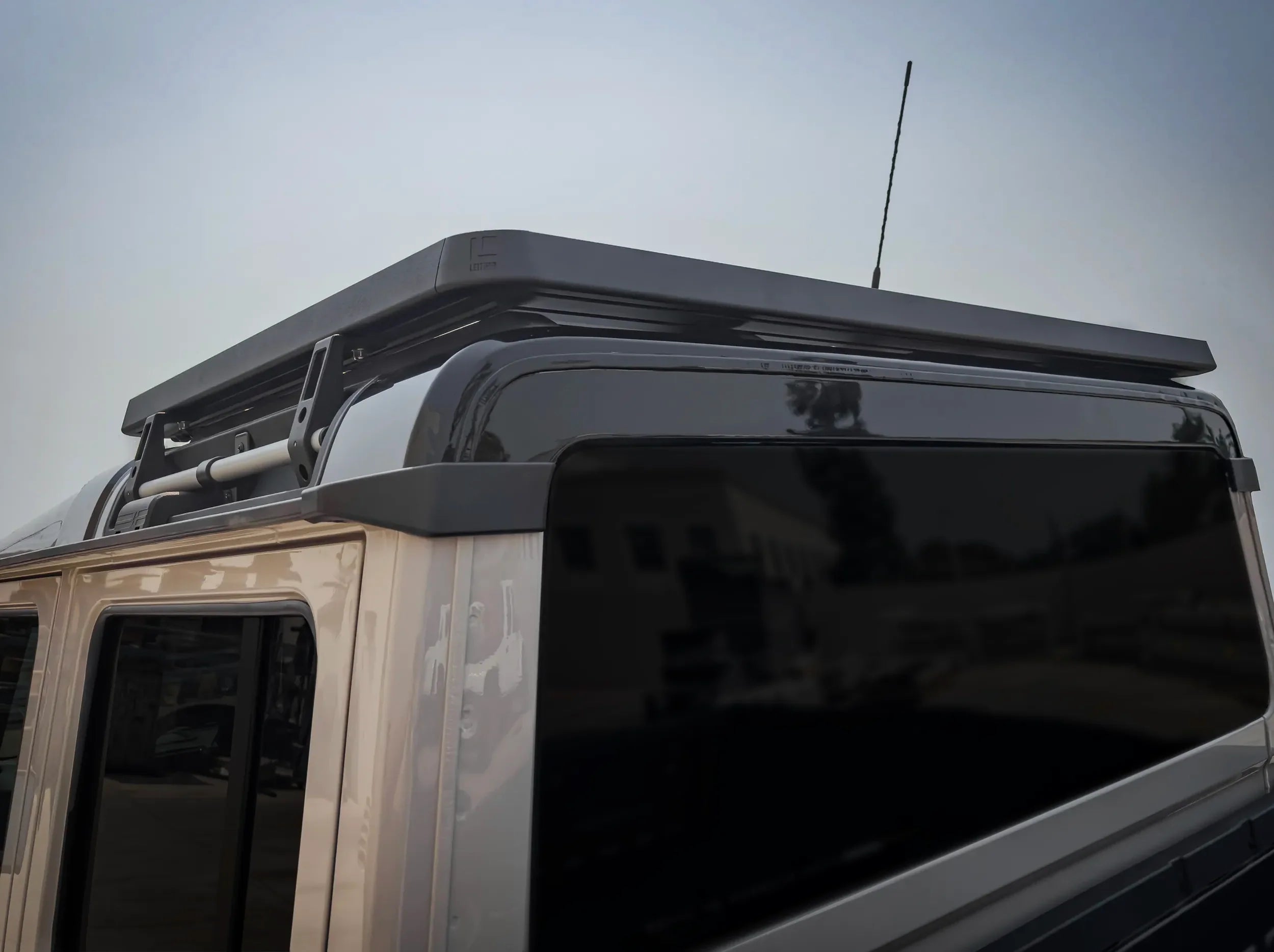 CLOSE UP REAR VIEW OF INEOS GRENADIER QUARTER MASTER HALF LENGTH PLATFORM ROOF RACK 