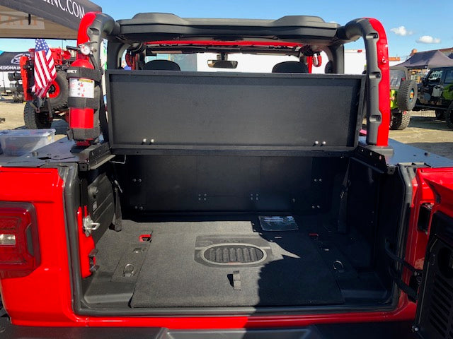 Red JL 2-door at an event with the Slipstream top lifted and cargo floor visible