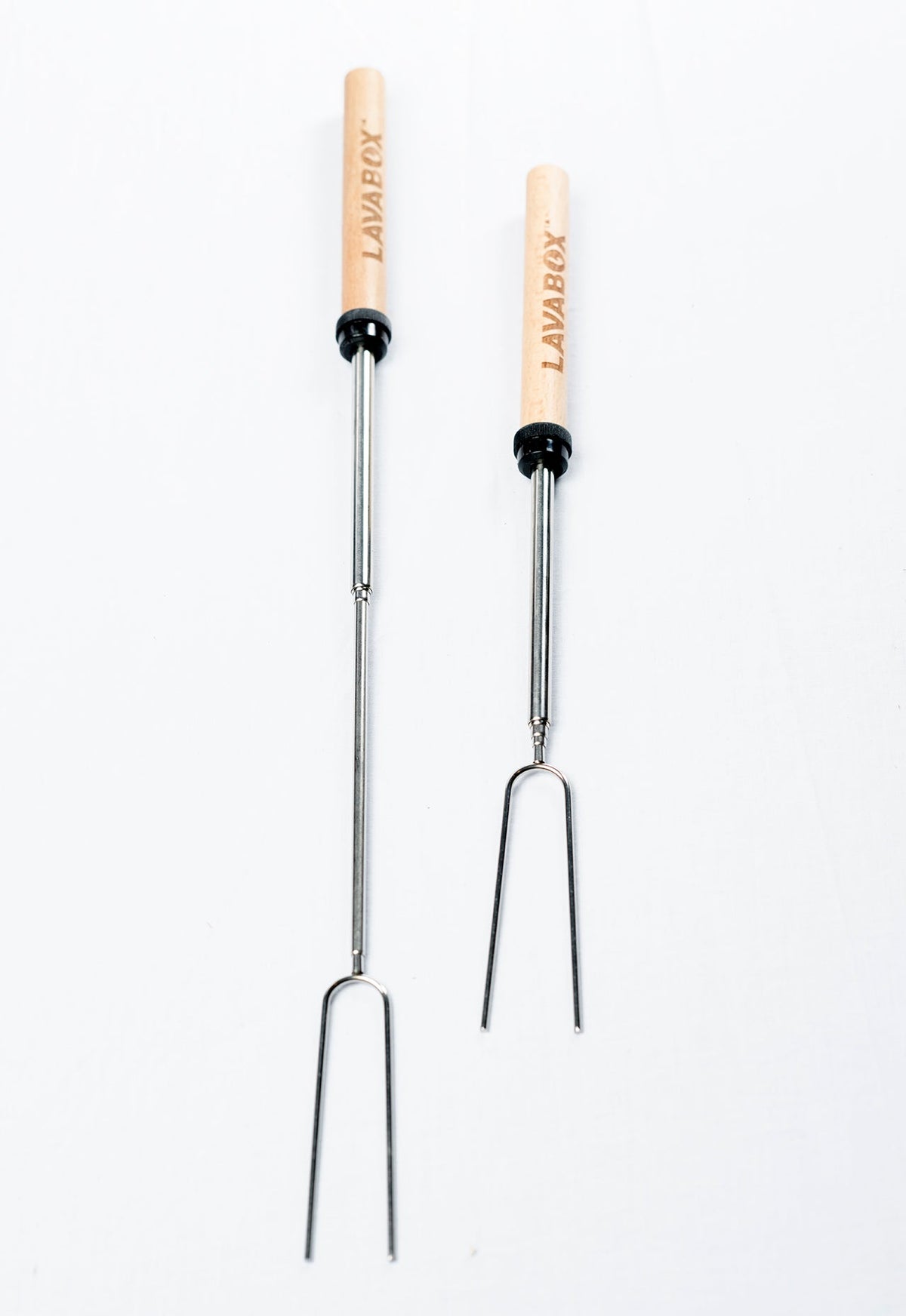 Two wooden-handled steel roasting fork skewers branded LAVABOX, studio shot on white background