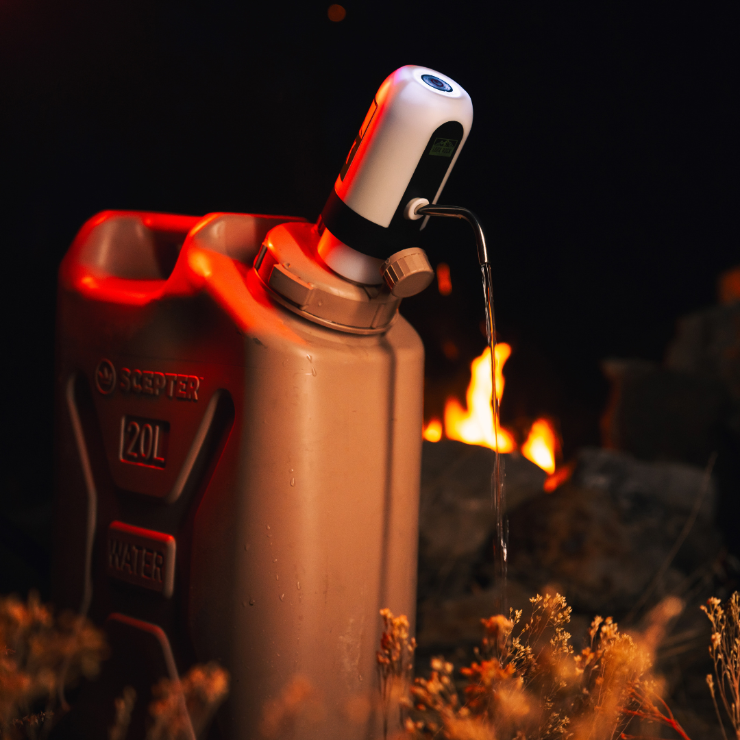 Lone Rock Concepts pump with illuminated button dispensing water from a tan Scepter can beside a campfire