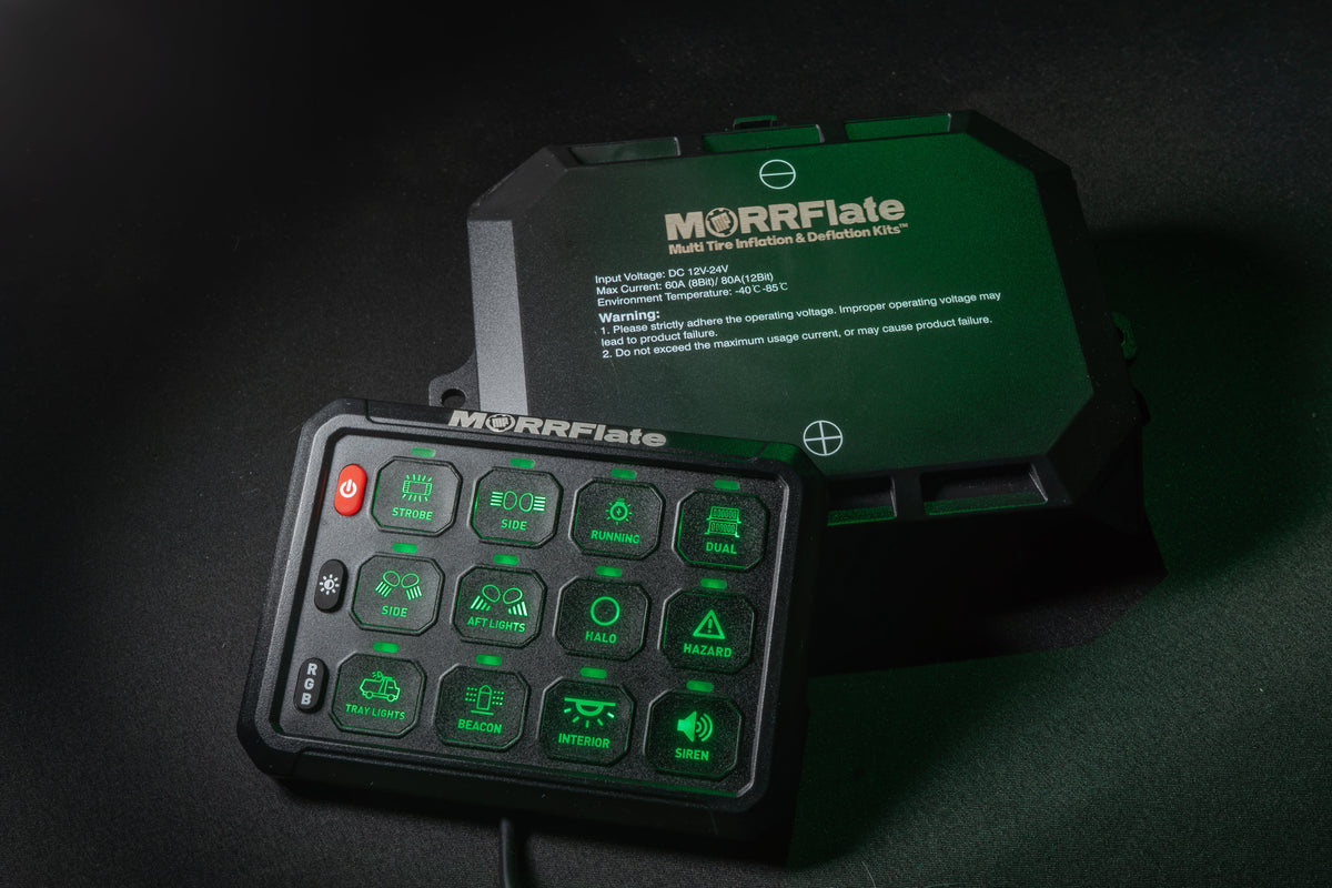 MORRFlate 12-gang switch panel in front of its black power control module with a specification label