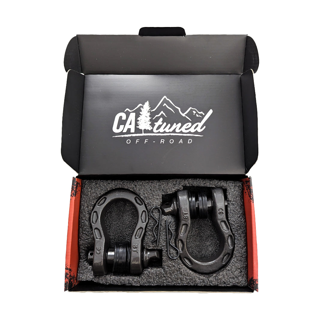 Open black box holding a pair of gray D-ring shackles