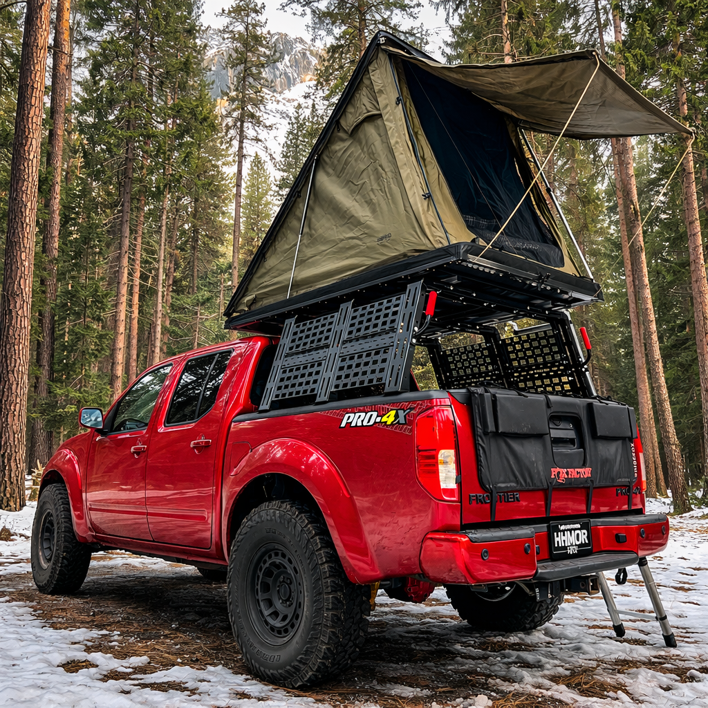 Red Frontier PRO-4X with ROCK-IT rack and open rooftop tent in snowy woods