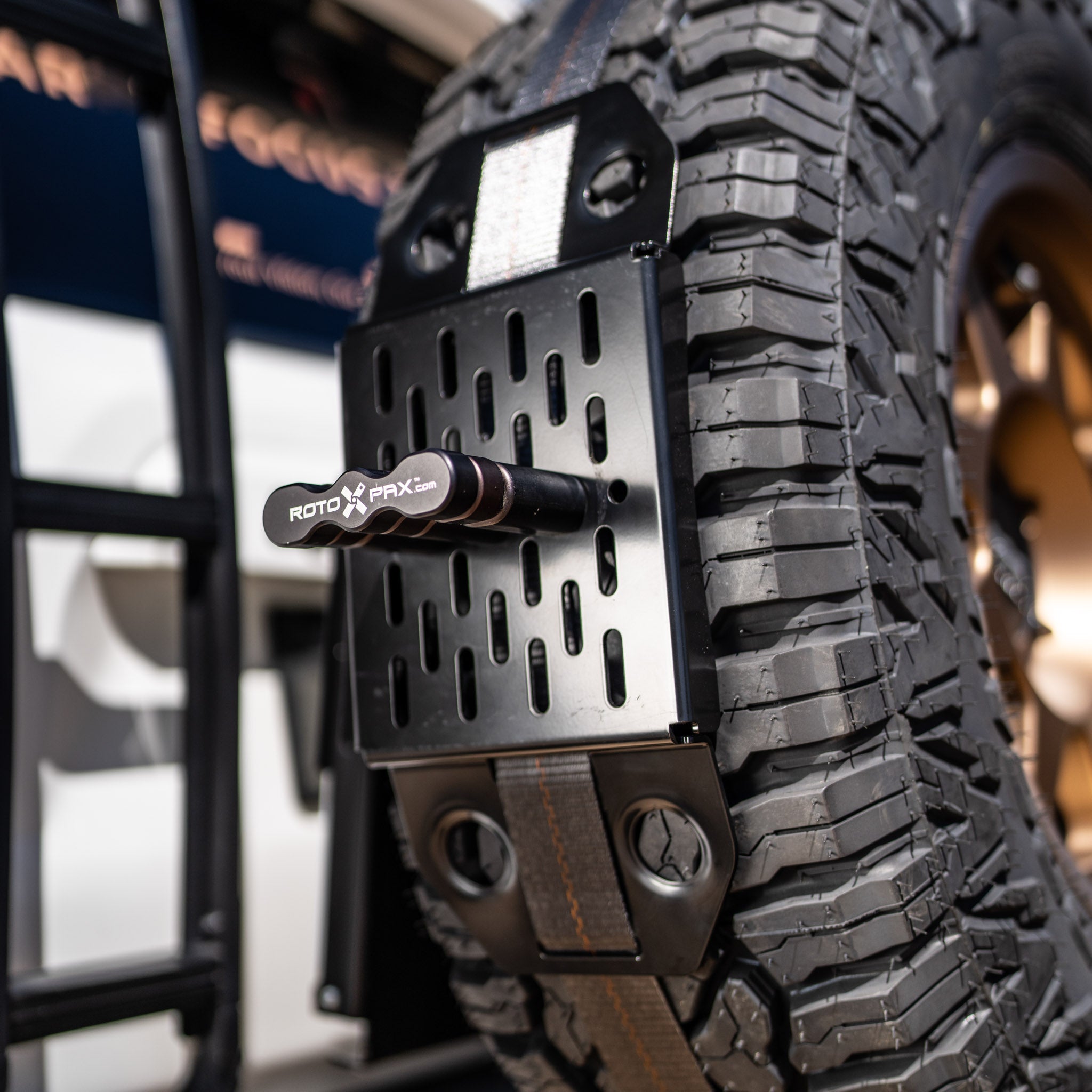 Detail of the spare tire bracket with a rotopax mount on a tire
