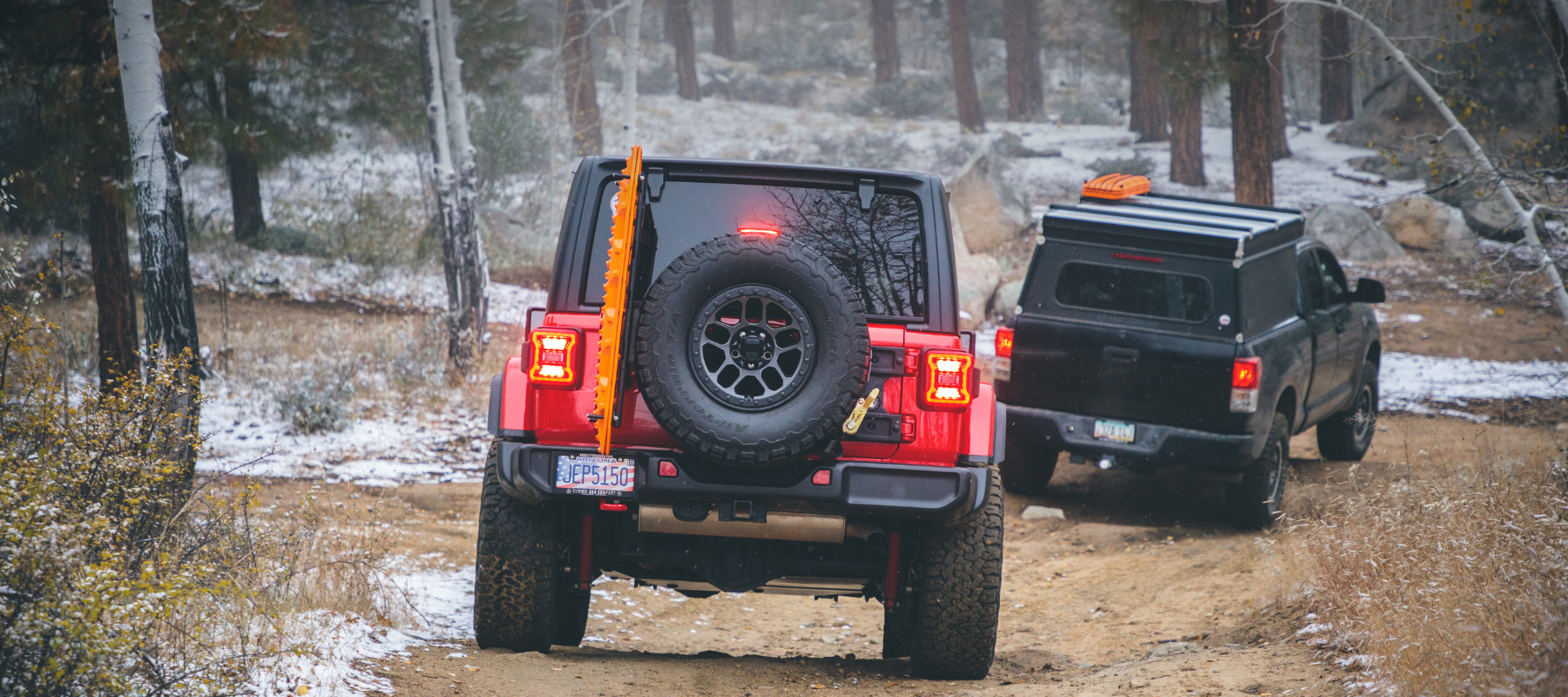 Overland Kitted Spare Tire MAXTRAX Mount On Jeep Wrangler Following Toyota Tundra With Go Fast Camper and Overland Kitted Boomerang MAXTRAX Mounts in Arizona.