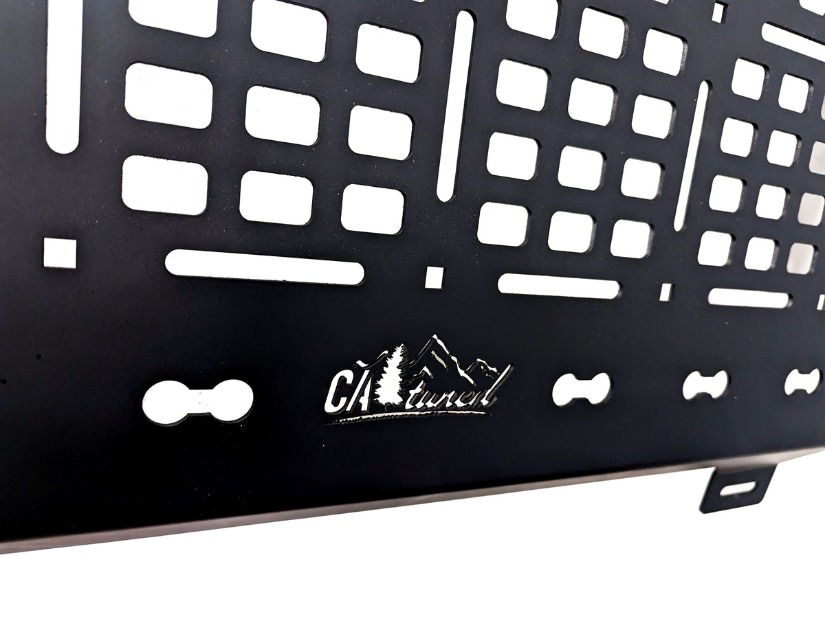 Close view of the MOLLE slots and logo along the lower edge of the panel