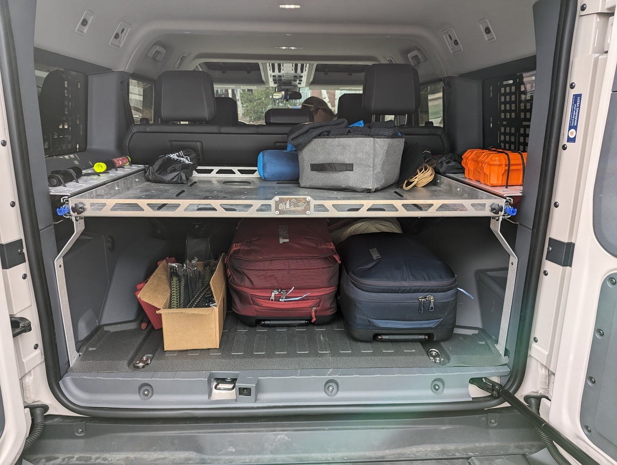 Rear cargo area with the shelf installed and bags stored below