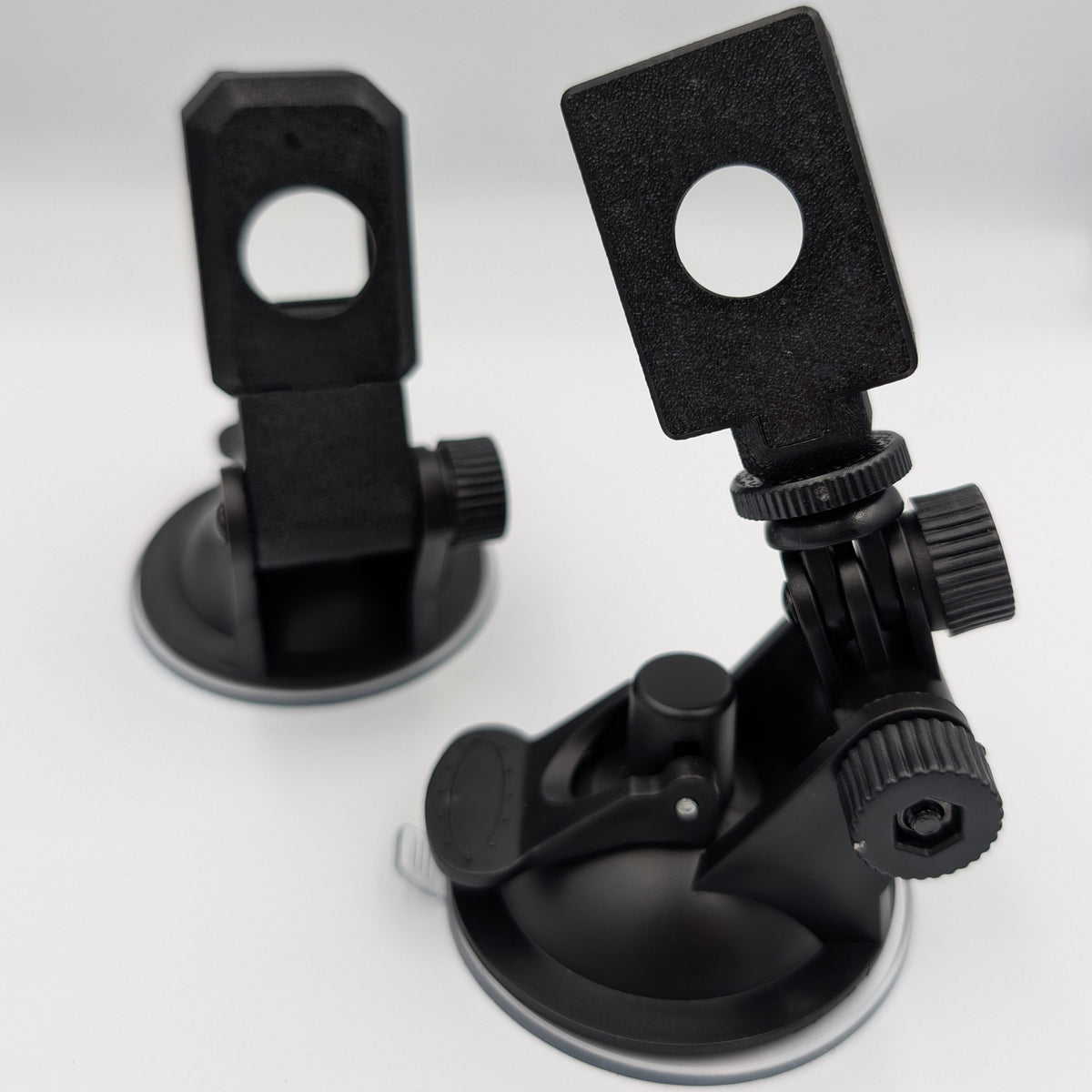 Two GG Offroad suction cup camera mounts with empty camera housings