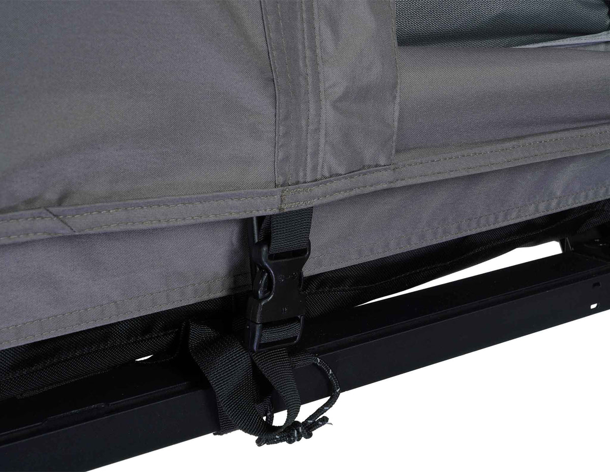 C6 Rev Rooftop Tent X (HellaStorm) – platform hinge and tent strap close-up