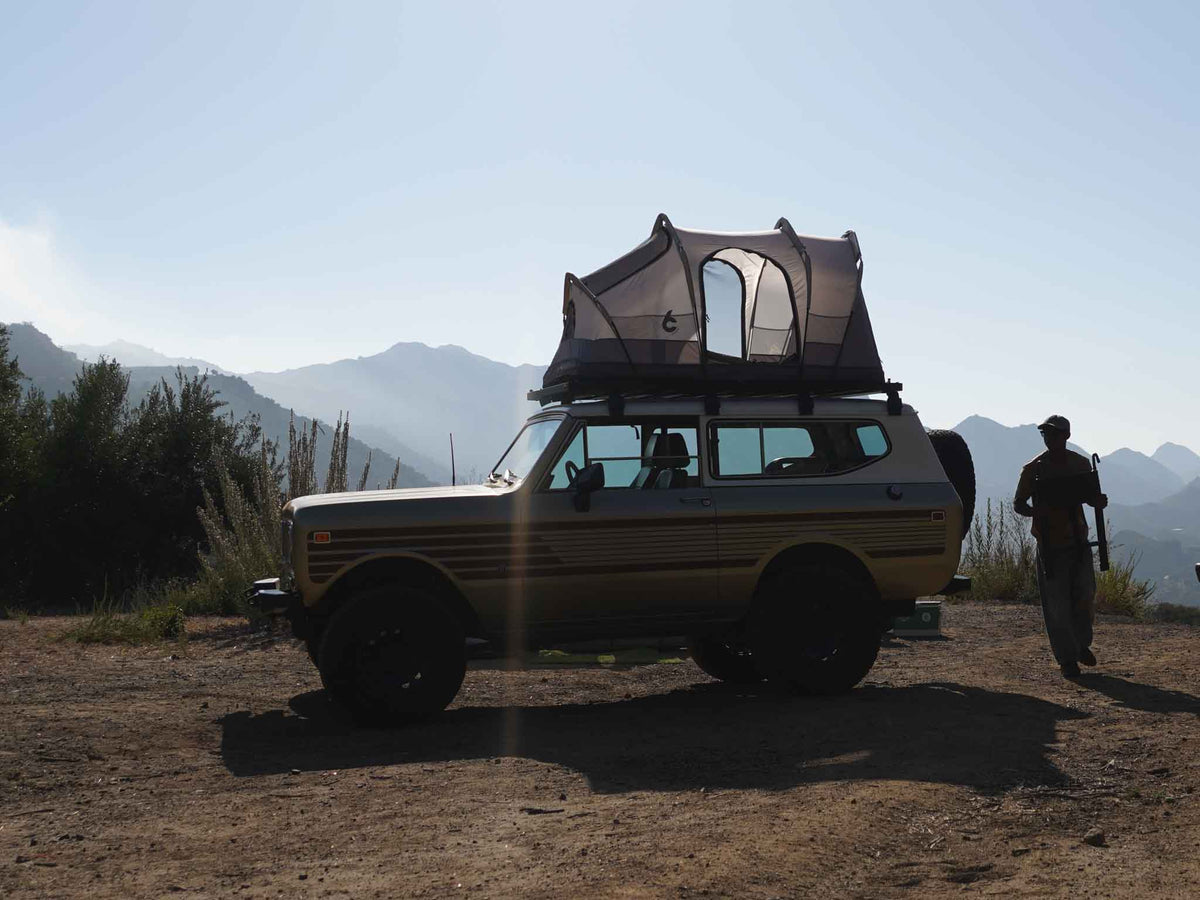 C6 Rev Rack Tent (Eclipse) – vehicle with the tent on its roof at camp