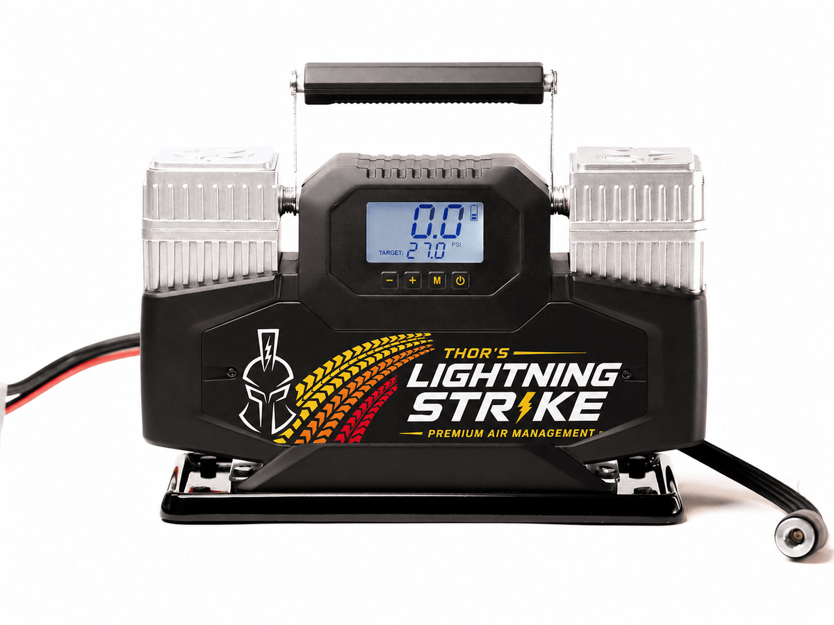 Thor's Lightning Lightning Strike Pro air compressor, Heritage Edition faceplate with orange tire-tread graphic, front view on white background