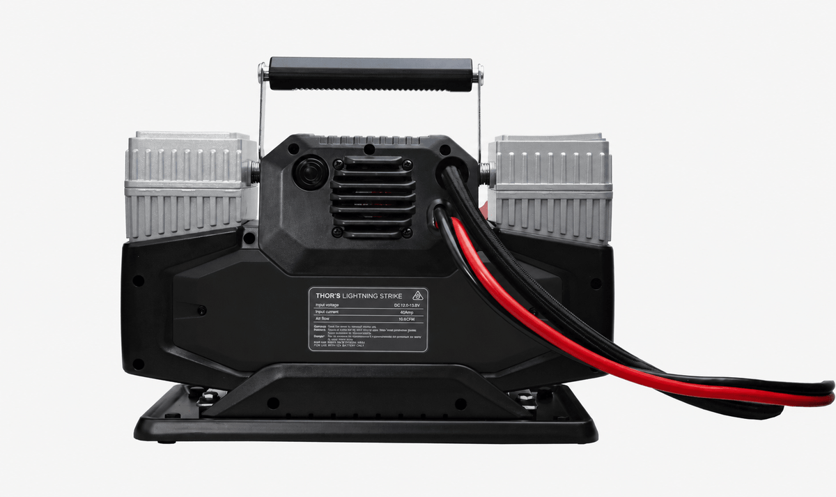 Lightning Strike Pro compressor rear view showing cooling vent, spec label, and heavy-duty power cables