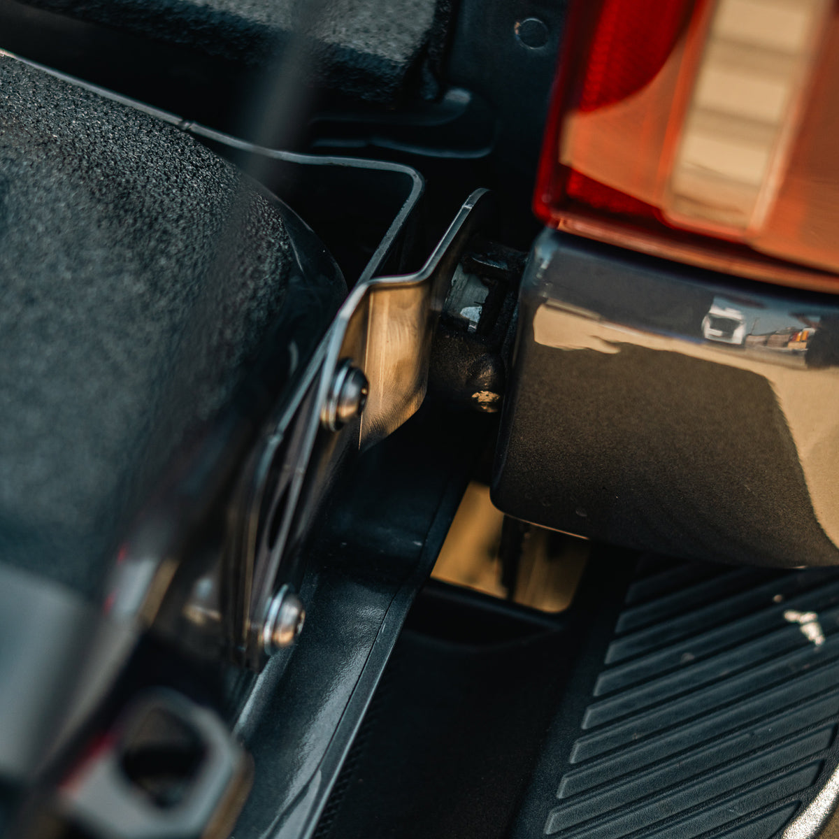Cali Raised LED tailgate theft protector installed on a Ford F-150 tailgate, wide angled view of the bed and side step