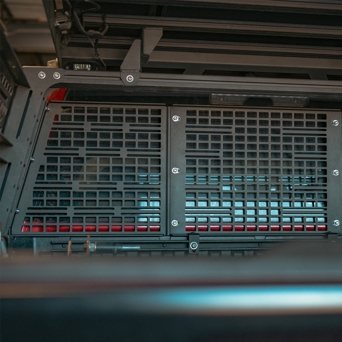 Angled view of the MOLLE headache rack mounted in a bed rack