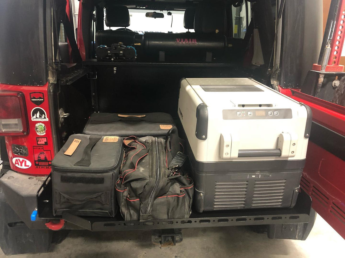 Loaded JKU slide floor, wider view with the tailgate open