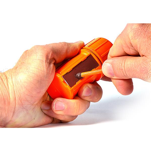 Hand striking a match against the striker on an orange UCO stormproof match case