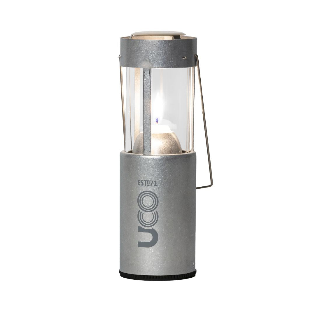 Silver UCO Candlelier candle lantern standing upright and lit
