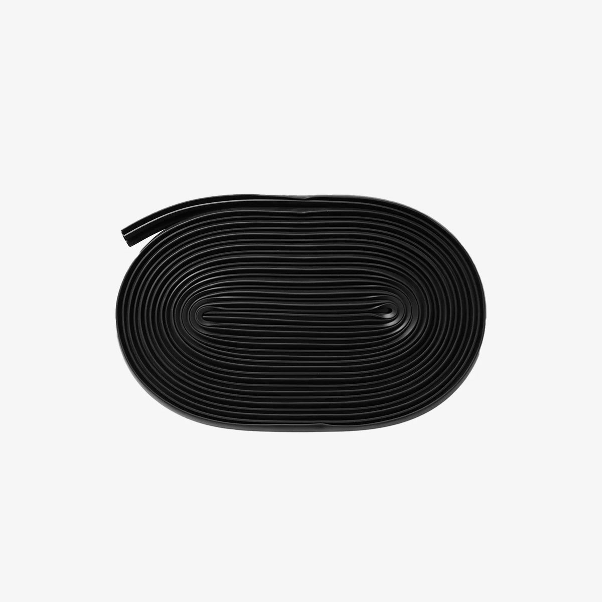 Coiled black T-slot weather strip