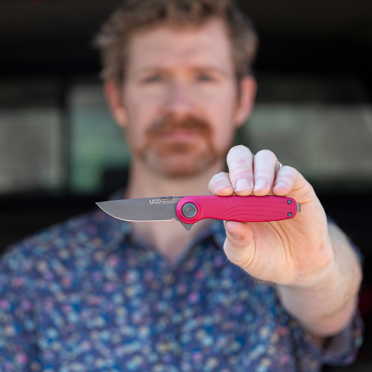 Red UCO Whidbey Mini folding knife shown open with blade extended