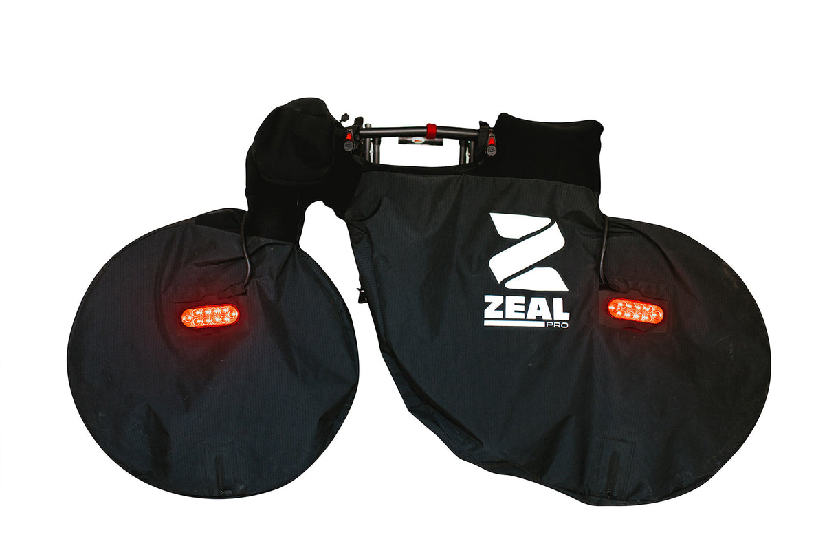 ZEAL Pro mountain and fat tire bike cover with both tail lights lit, studio profile