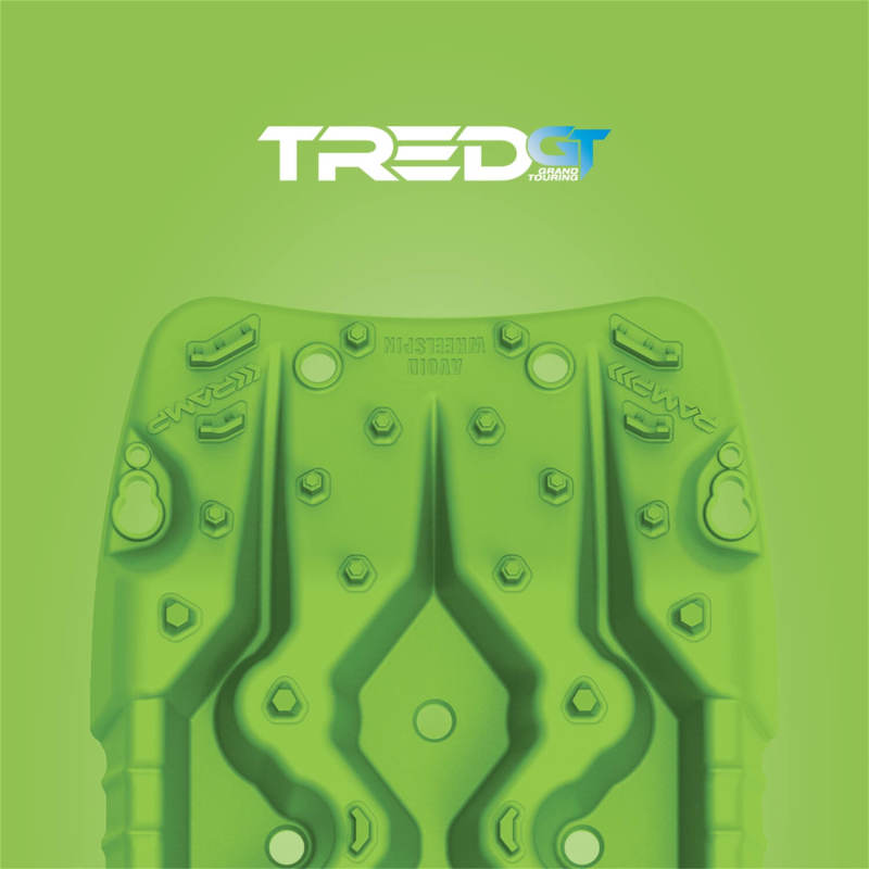 TRED GT recovery board under a vehicle tire during off-road recovery — Fluorescent Green