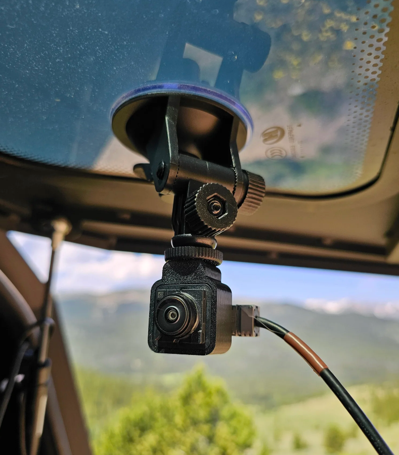 GG Offroad suction cup camera mount on topper glass holding a factory camera
