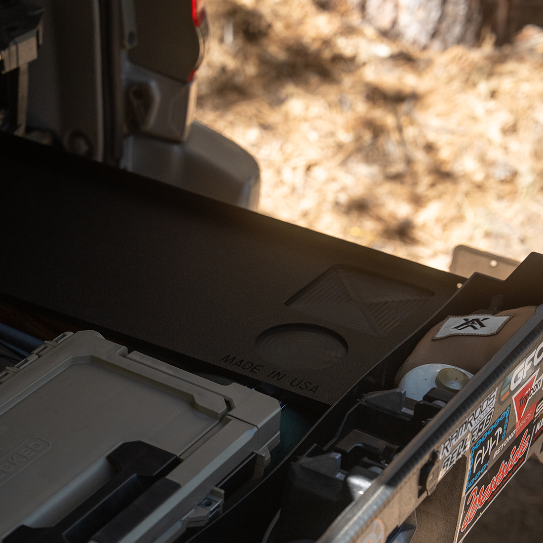 Mountain Hatch Grab n' Go board on a slide-out drawer in a truck bed at camp