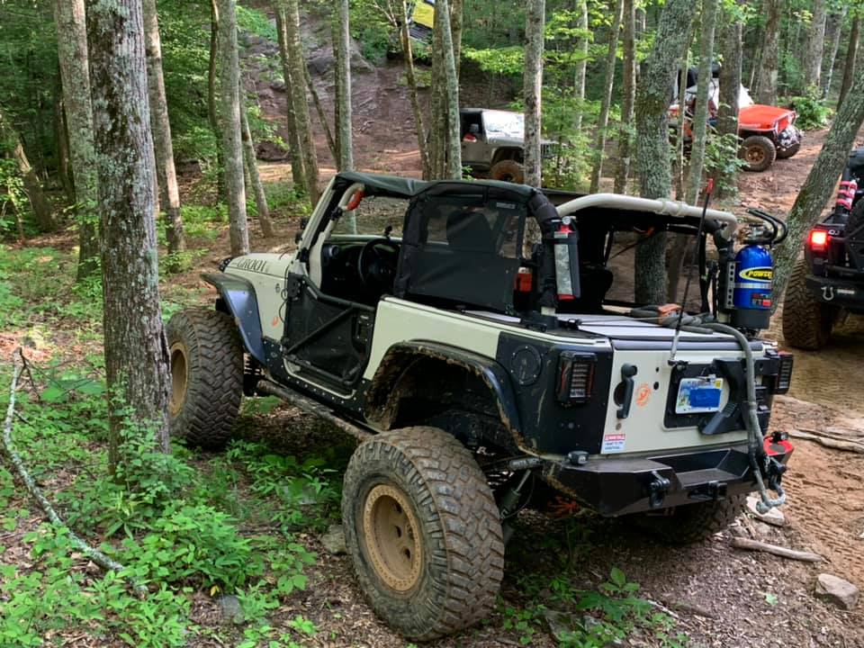 Jeep JK 2-door on a wooded trail with the Slipstream fitted