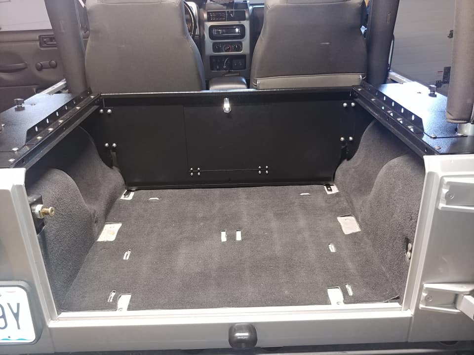 Slipstream forward wall installed in an empty JK tub, viewed from the tailgate