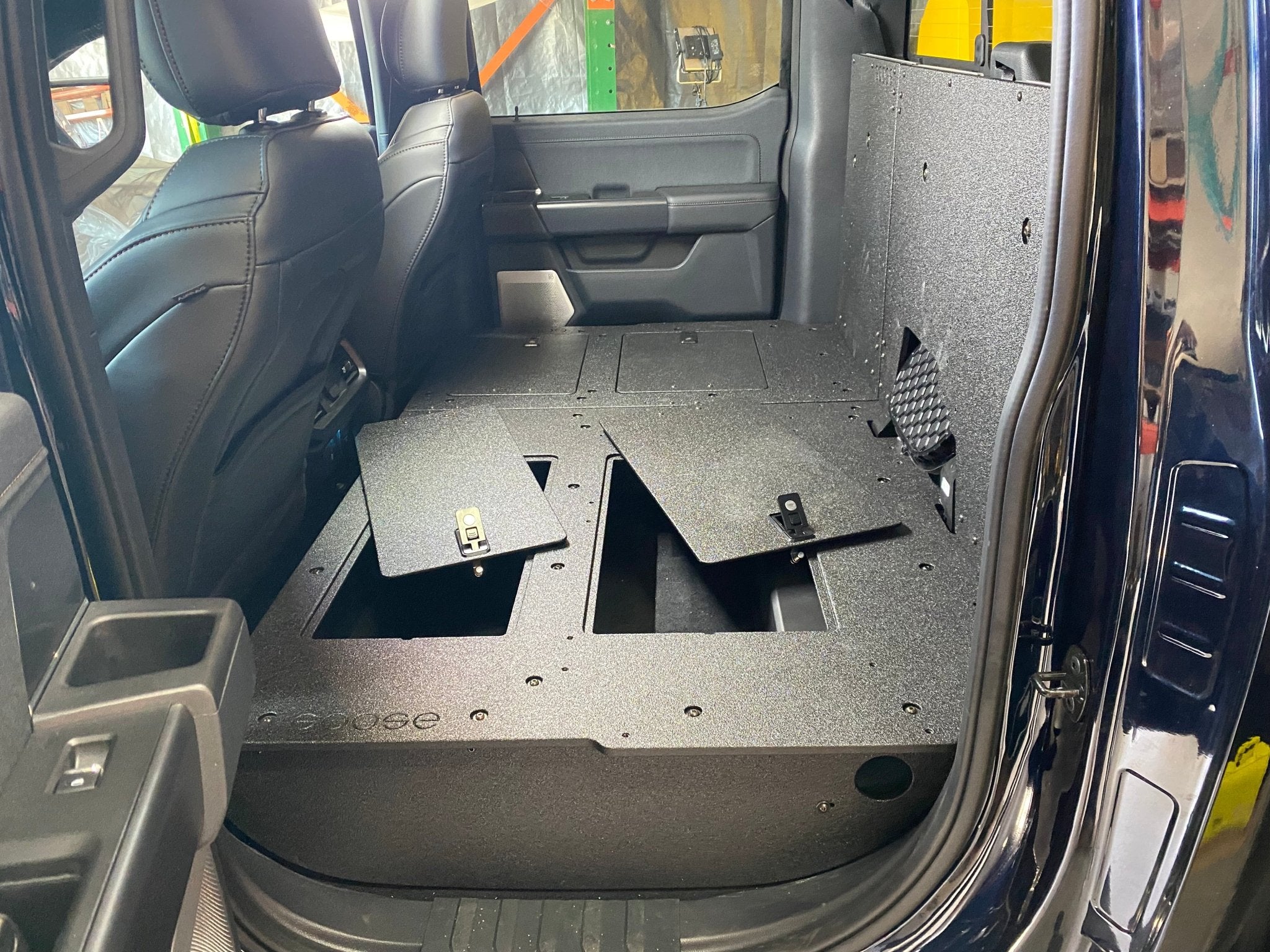 Ford - F150 2021-Present - 14th Gen. SuperCrew - Second Row Seat Delete Plate System with Factory B&O Subwoofer Center Wall with Exterior Port Seat Delete Plate System Goose Gear- Overland Kitted