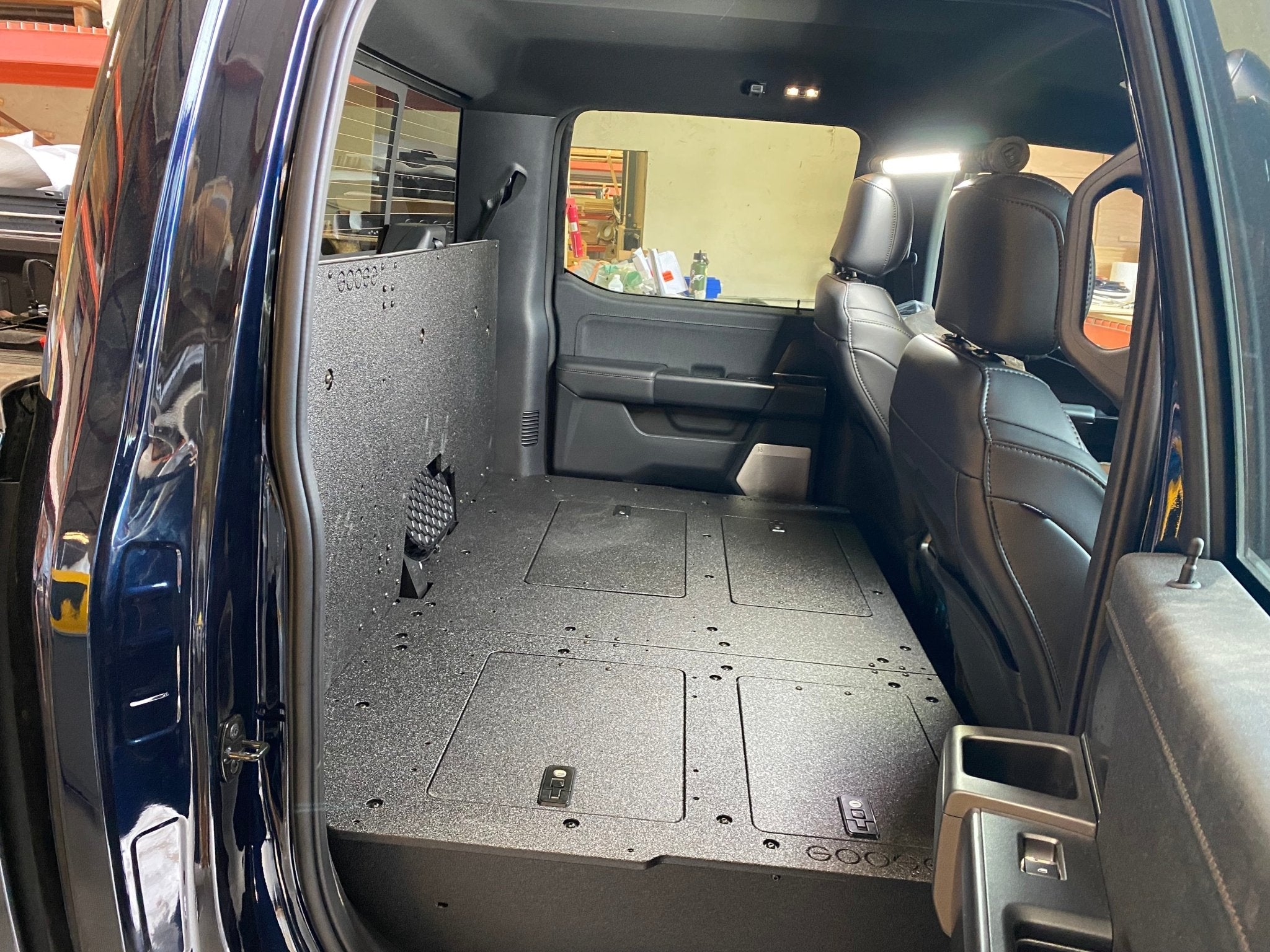 Ford Super Duty Ford - F250-F350 - 2023-Present - 5th Gen. Crew Cab - Second Row Seat Delete Plate System with Factory B&O Subwoofer Center Wall with Exterior Port Seat Delete Plate System Goose Gear- Overland Kitted