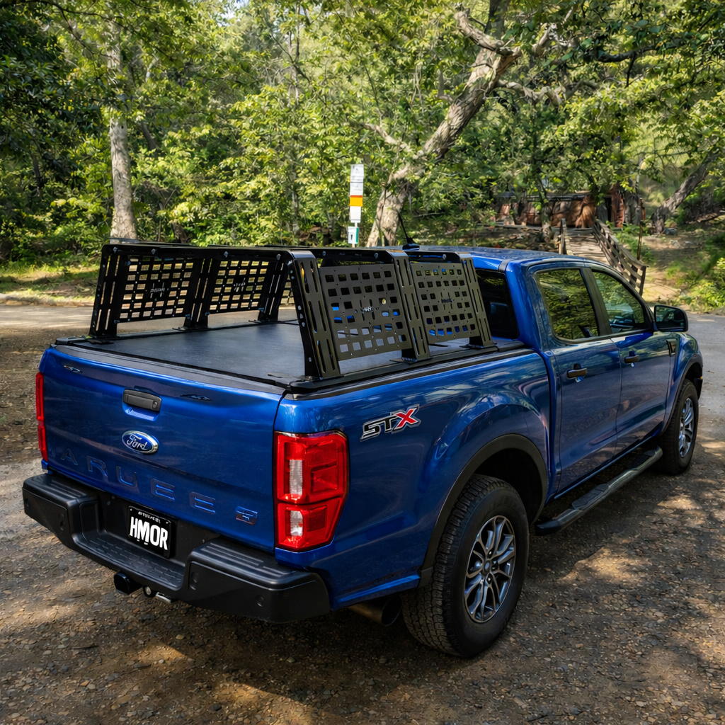 Blue Ford Ranger with HMOR ROCK-IT rack and bed cover, rear quarter view