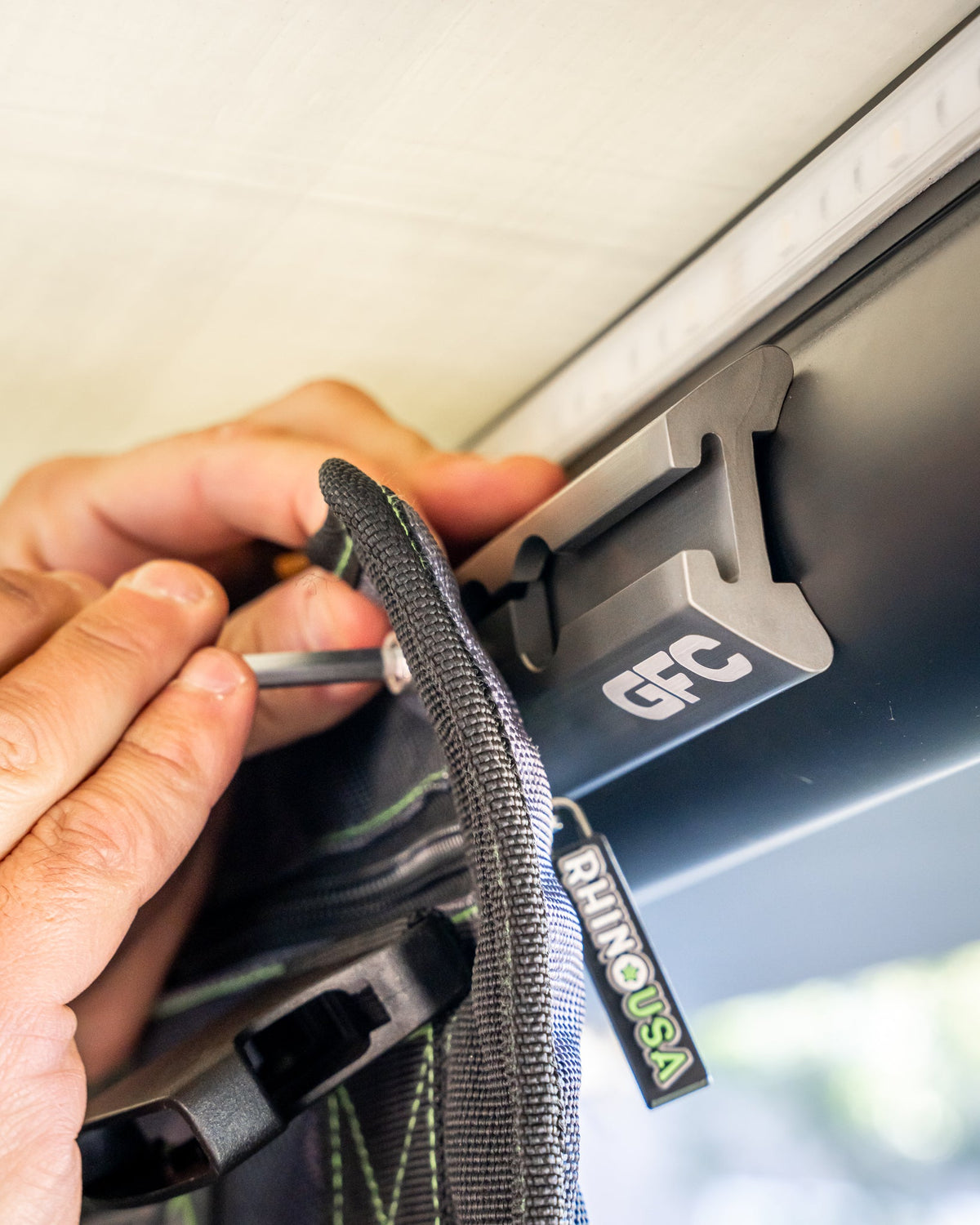 Hanging a gear organizer from L-track nuts inside a GFC camper