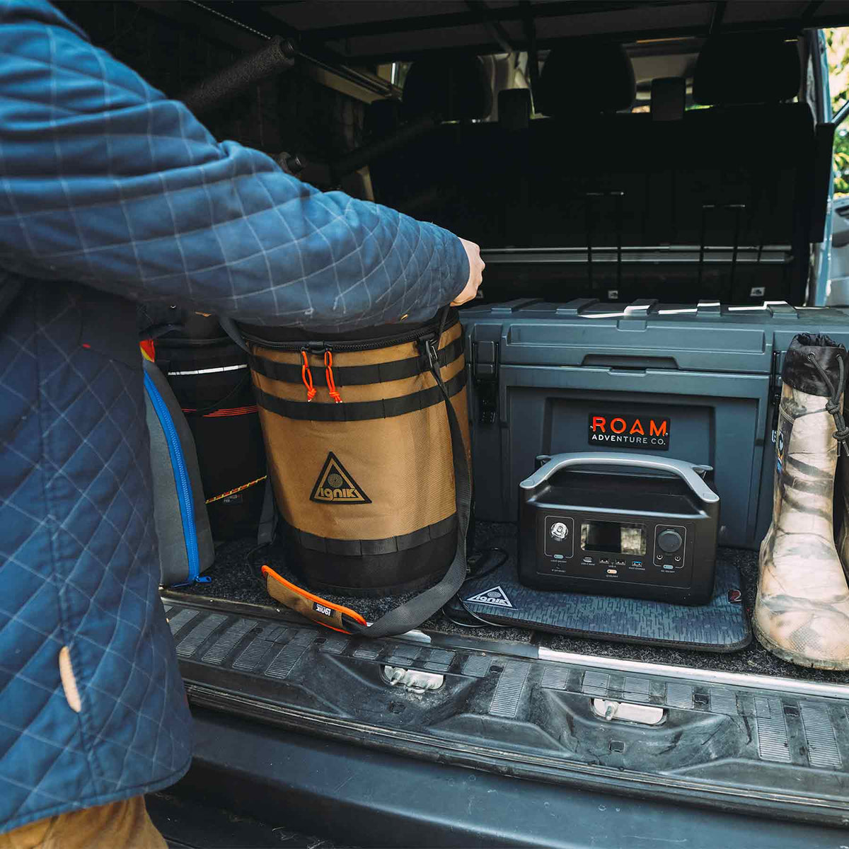 Ignik 20lb tank case seat – in a vehicle rear next to a portable power station