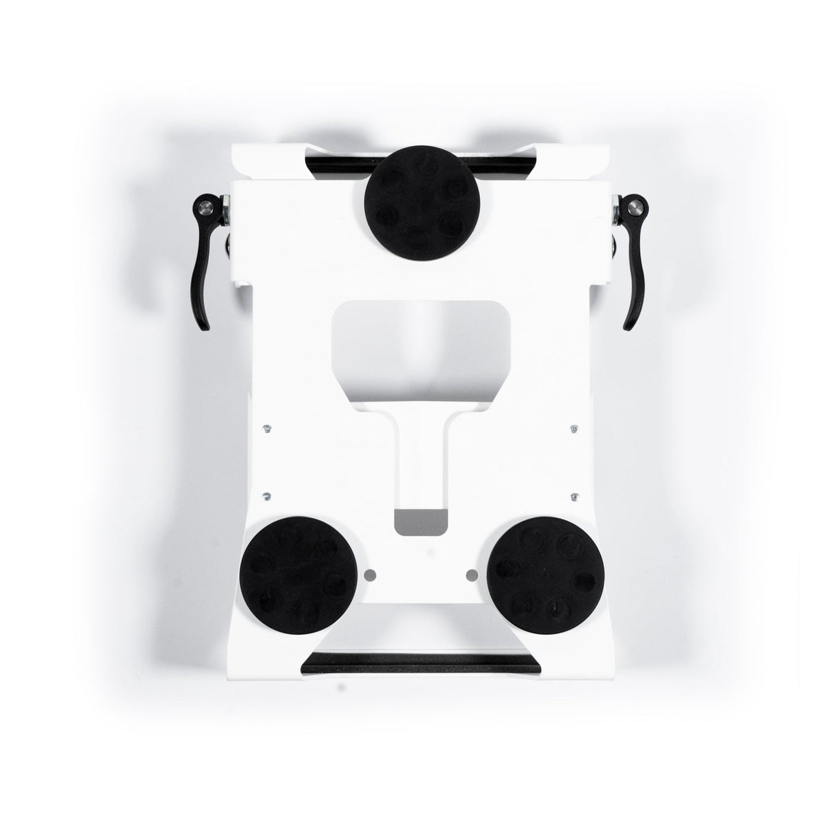 White Revolink mount with three rubber-coated magnets fitted, underside view