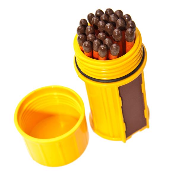 Yellow UCO stormproof match case standing open with matches inside