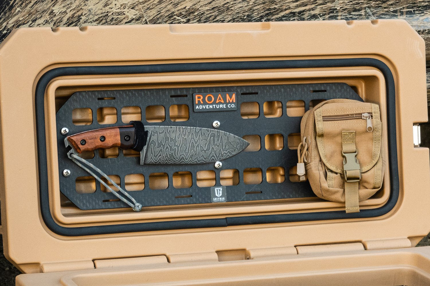 Aluminum MOLLE panel installed in a ROAM 95L Rugged Case with pouches