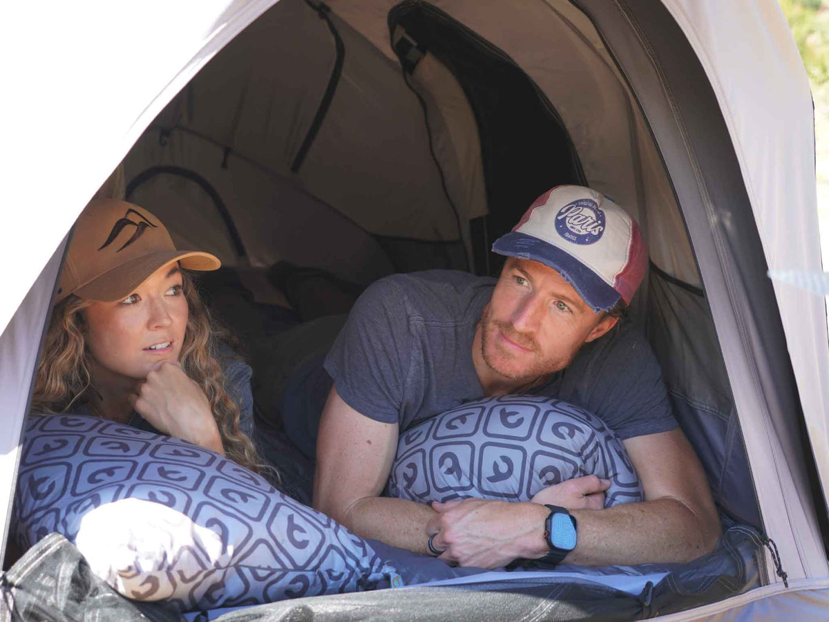 C6 Rev Tent (Element) – couple resting inside the tent