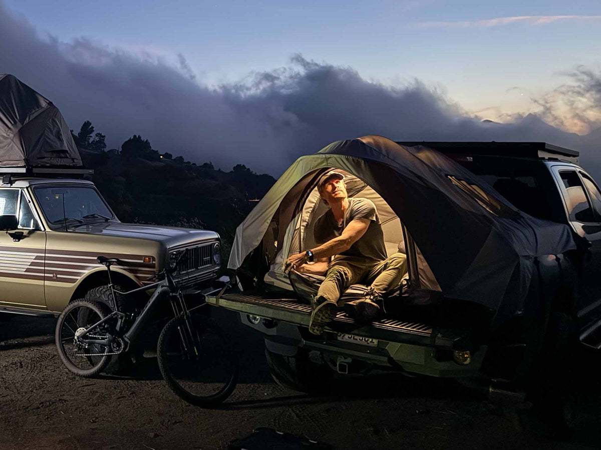 C6 Rev Pickup Truck Tent – tent set up on a truck at dusk