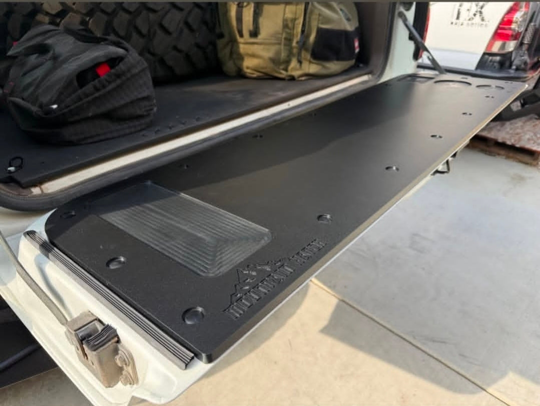 Mountain Hatch tailgate table on an 80 Series Land Cruiser tailgate with the recessed tray at the driver side